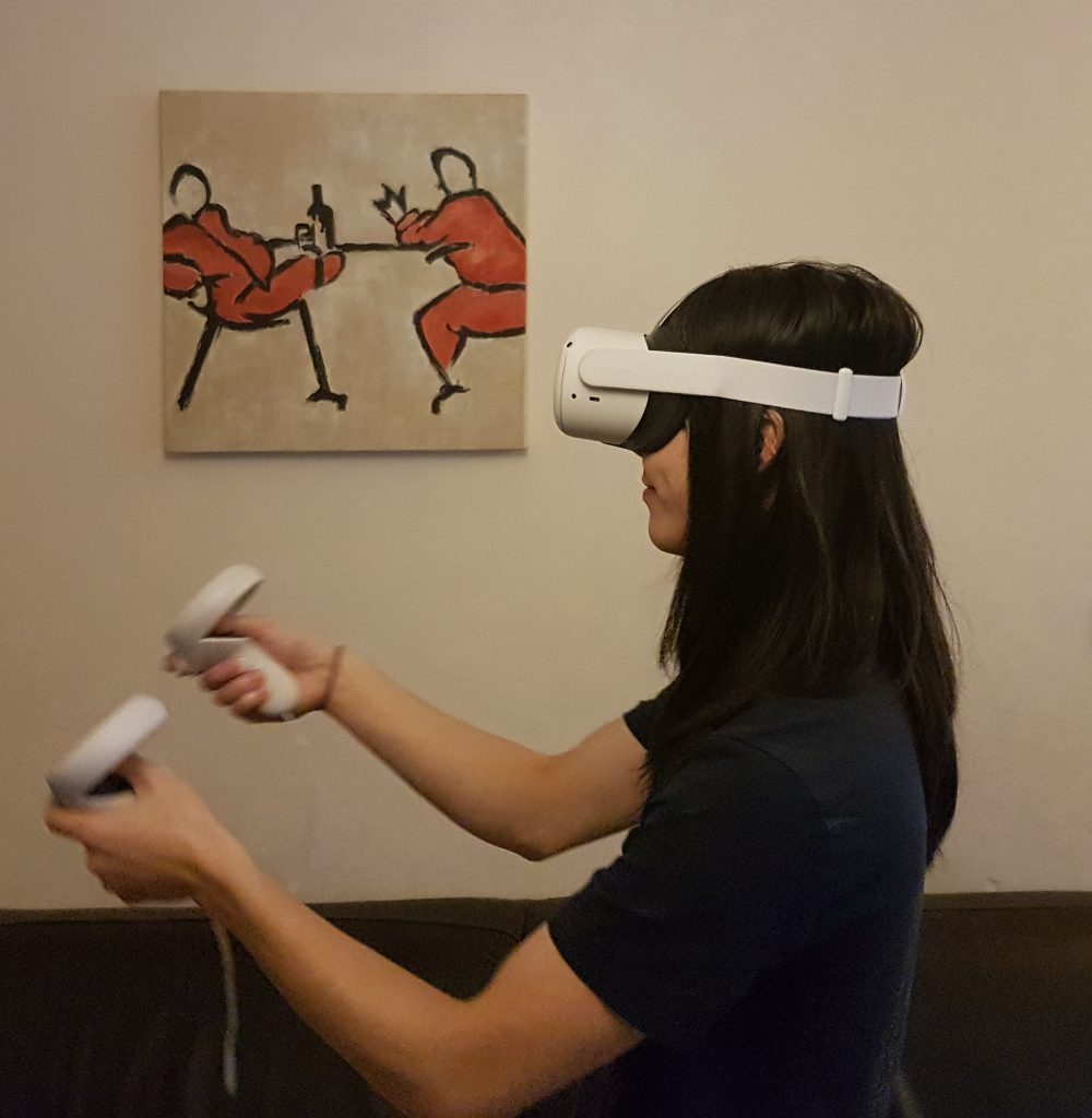 Photo of a person wearing an Quest VR headset